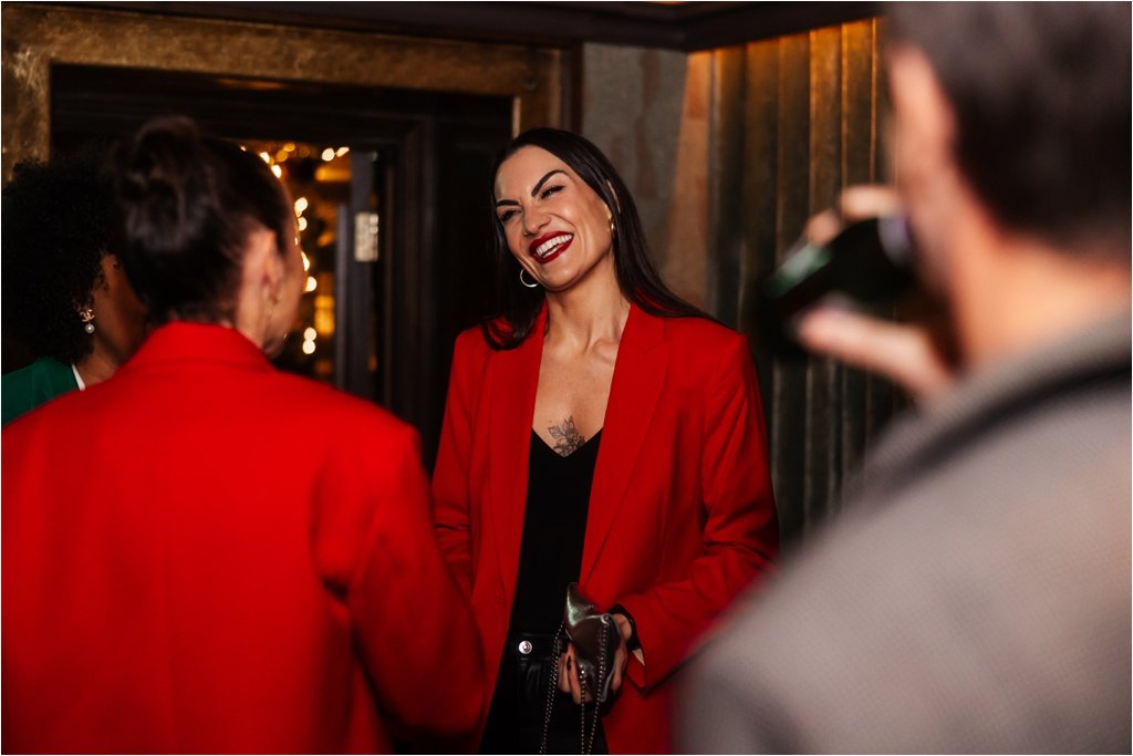 guests smiling whilst talking at the venue