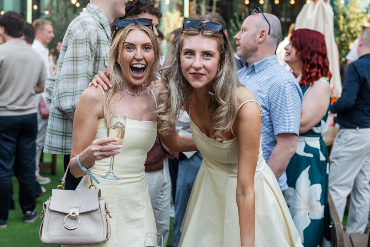 staff smiles at camera lawn club Manchester 